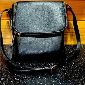 Black Jessie James concealed carry crossbody. Carried for 2 weeks